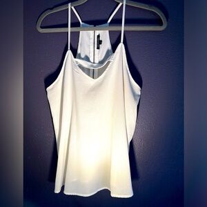 Rayon blouse with cut-out front detail and back zipper. Great condition. Worn 1x